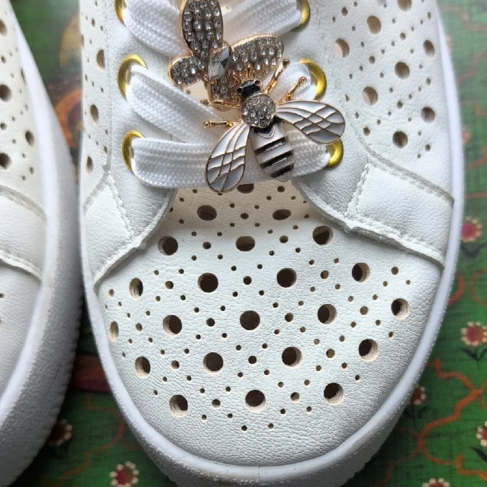 DV by Dolce Vita White Laser-Cut Sneakers with Gold Bee Charms